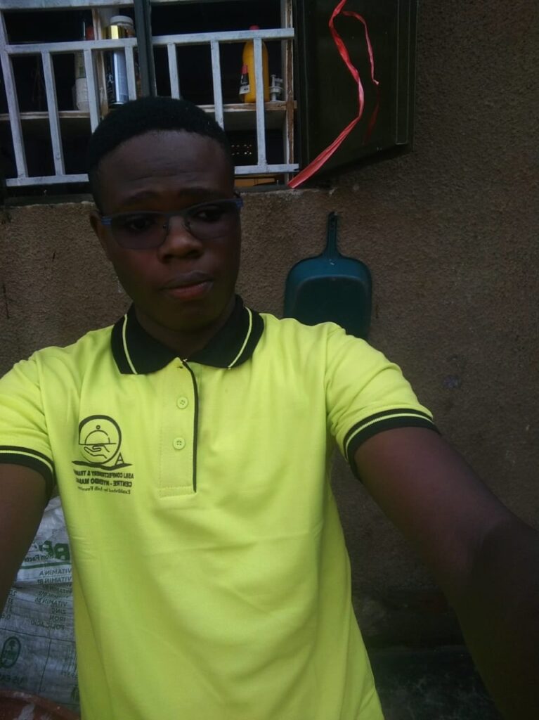 Young man in bright yellow shirt smiling