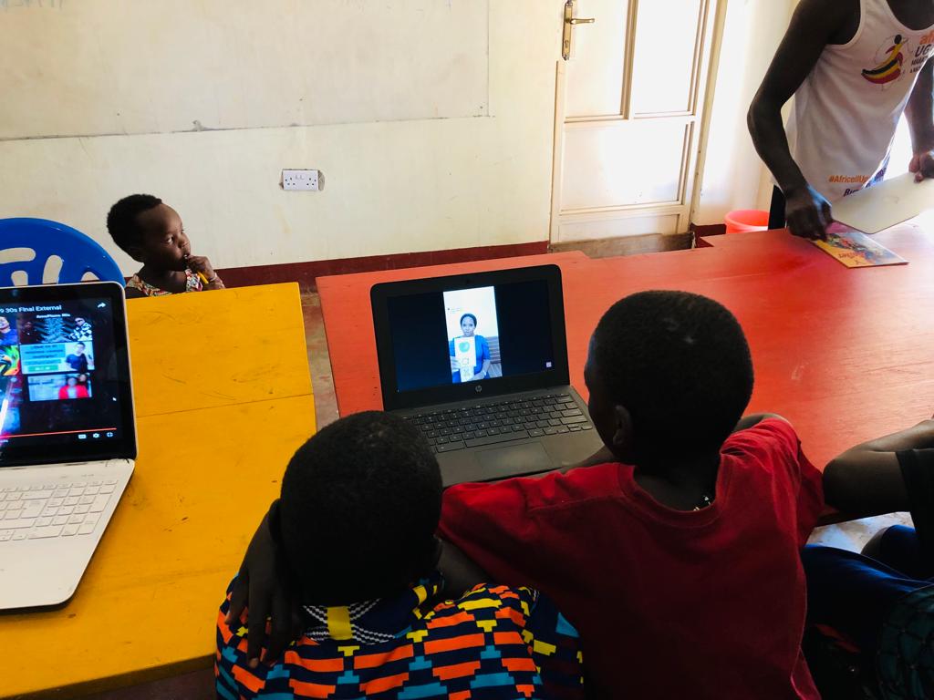 kids learning remotely at laptops
